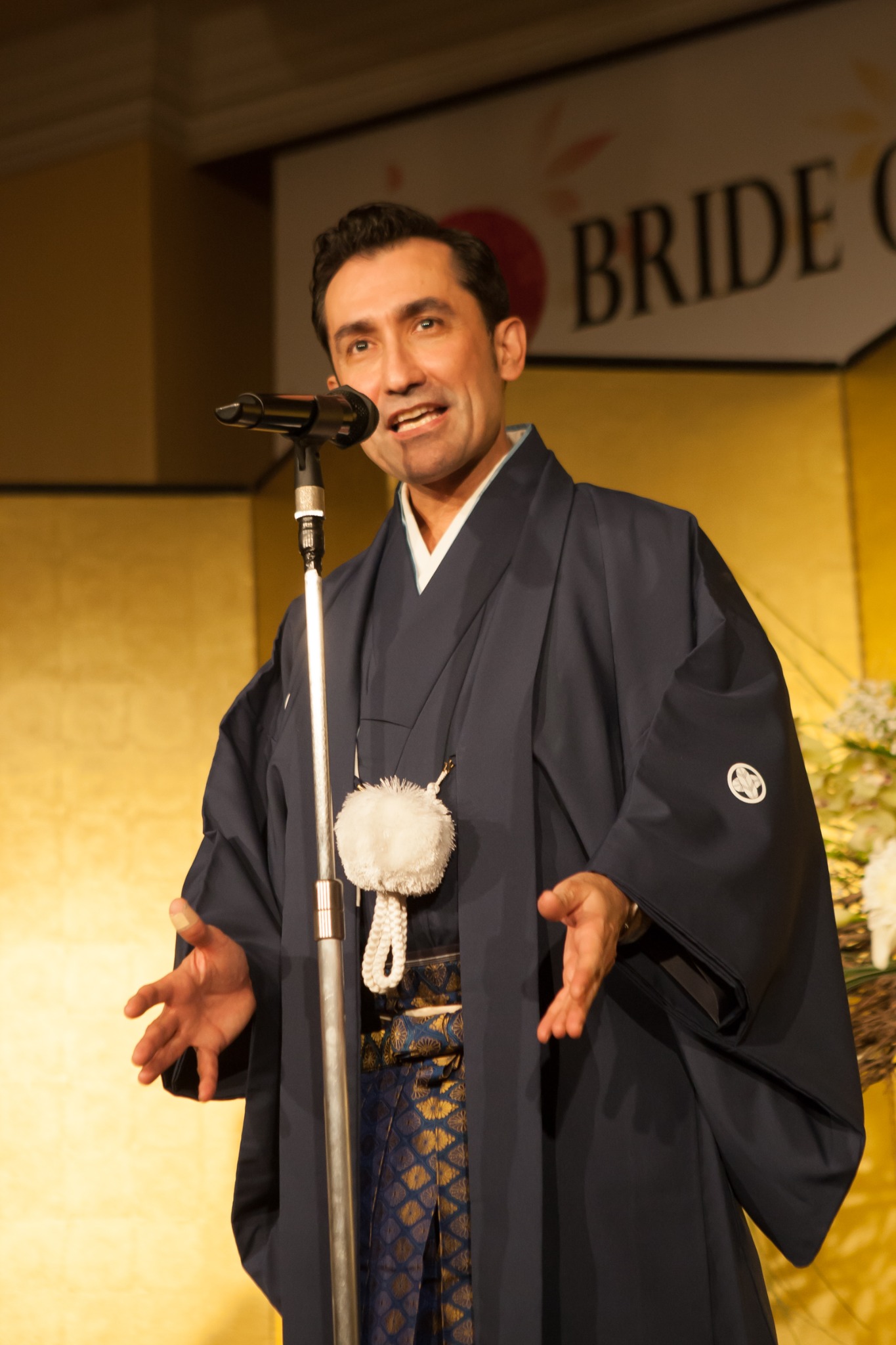 Sena delivering opening remarks in traditional Japanese attire